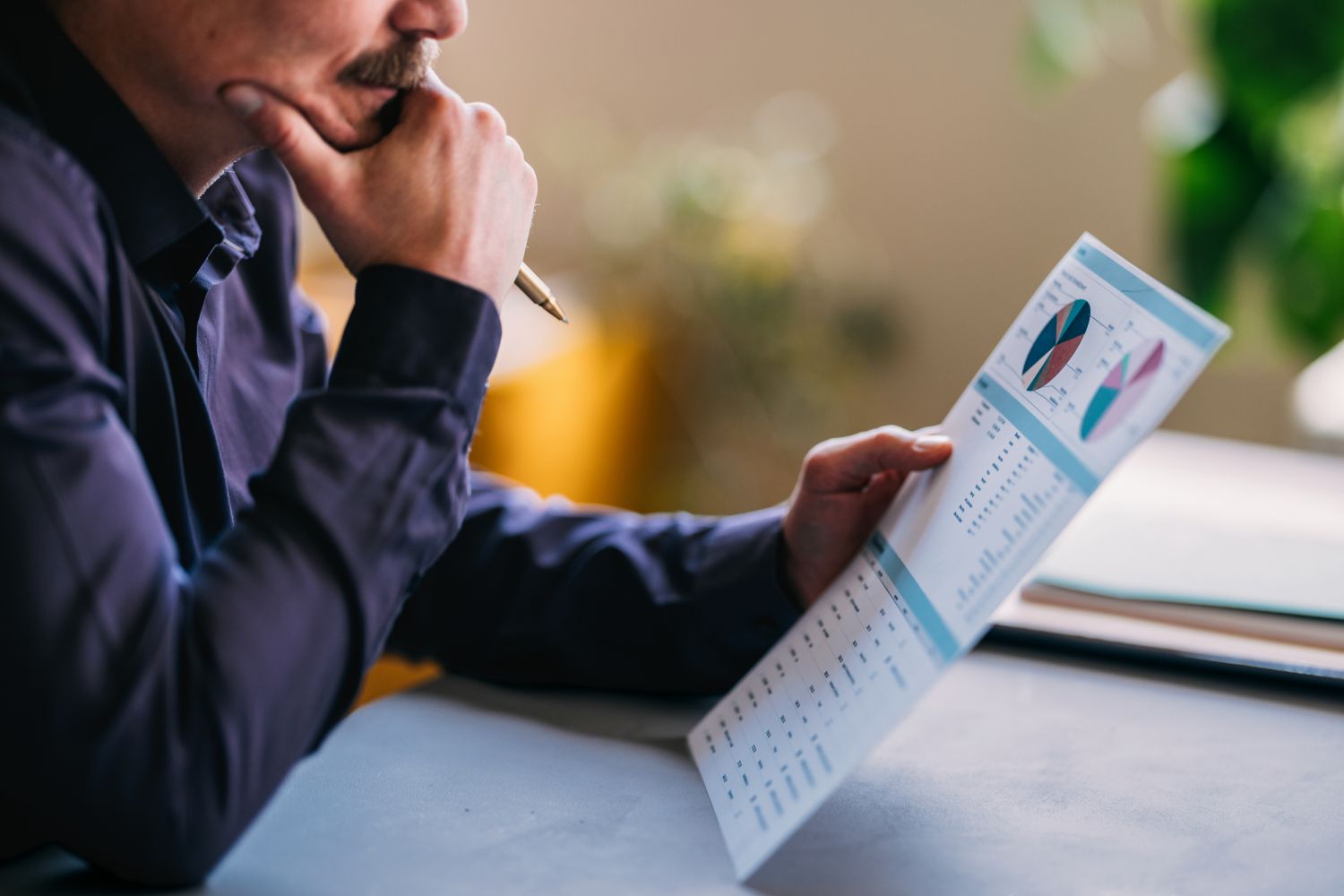 Office professional looking at a chart image